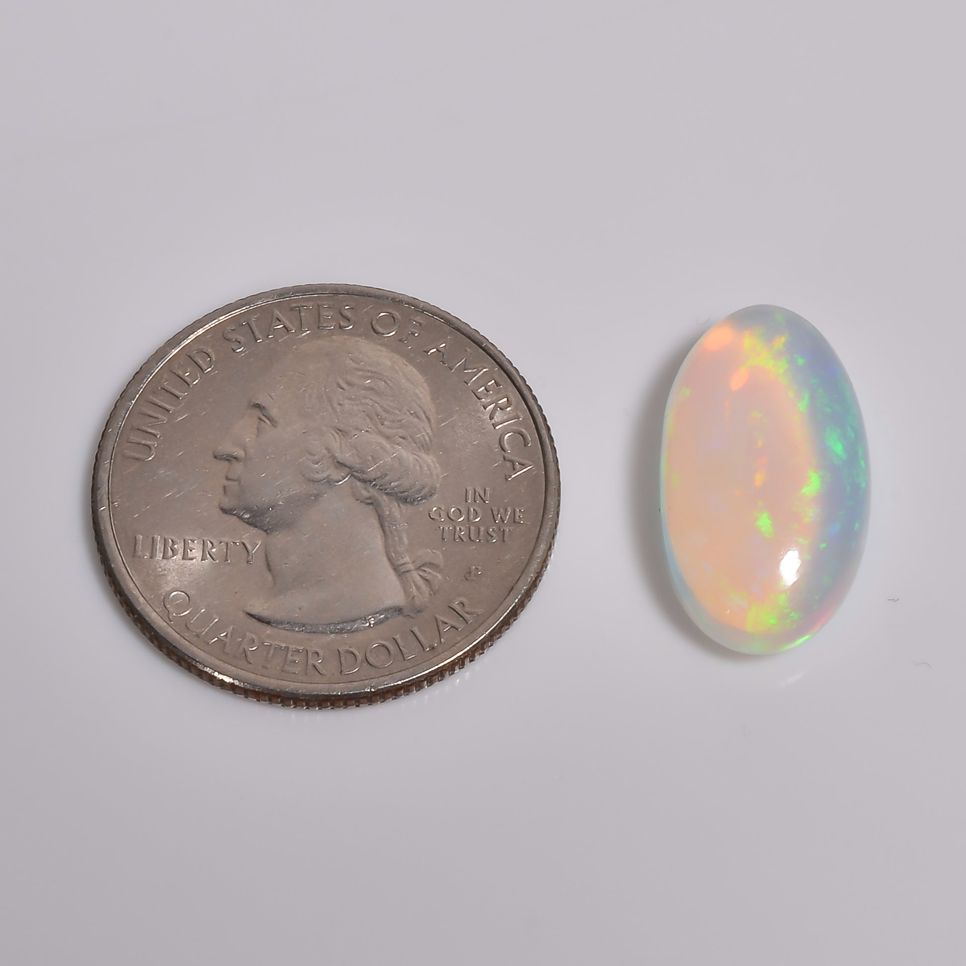 Oval-shaped 6.50 Carat White Ethiopian Opal loose Gemstone with vibrant fire play 
