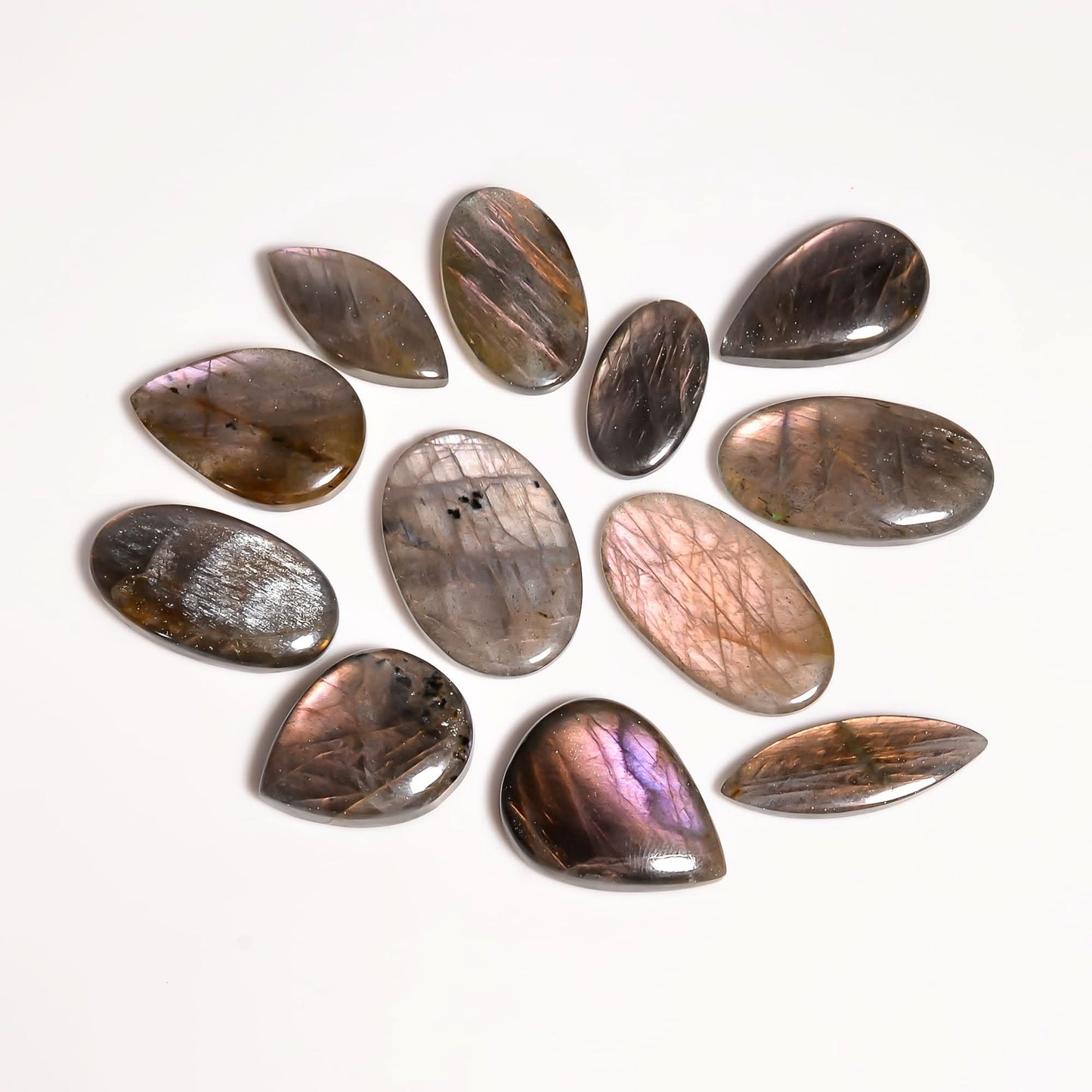 Wholesale bulk deal of labradorite stones showing flash and color.
