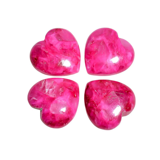 Four bright pink Mohave turquoise hearts with glossy domed tops on a white background