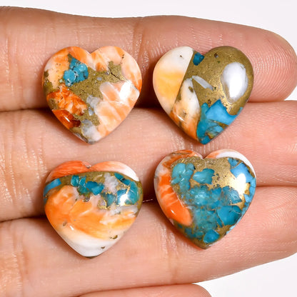 Colorful turquoise gemstone hearts for jewelry making held on a hand to show the 15 MM size