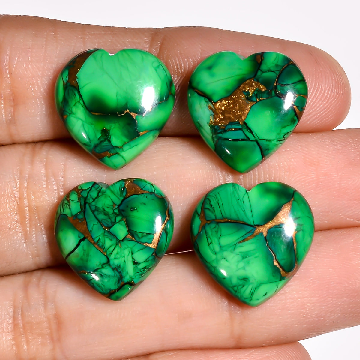 Dark Green Turquoise heart cabochon shown in its protective packaging, giving buyers a sense of how the stone arrives upon order