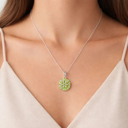 Necklace with a green pendant worn by a model