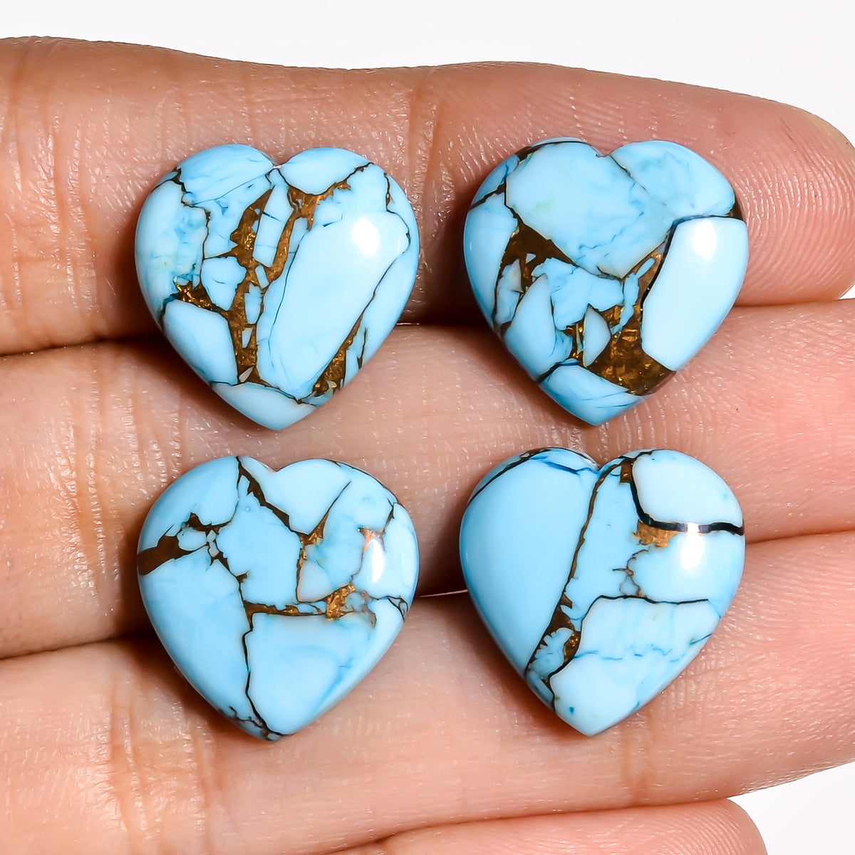 Light blue turquoise heart cabochon placed in its padded packaging, the way the stone arrives after you order