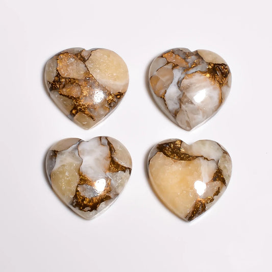 Loose turquoise gemstone hearts showing shiny gold copper veins and polished domed tops
