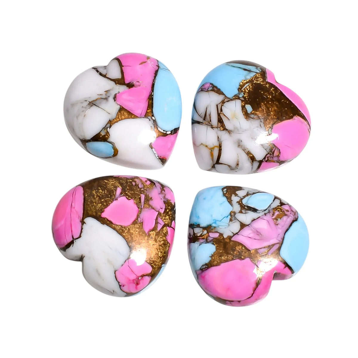 Pink and white Mohave turquoise stones for jewelry making held in hand to show 15 MM heart size