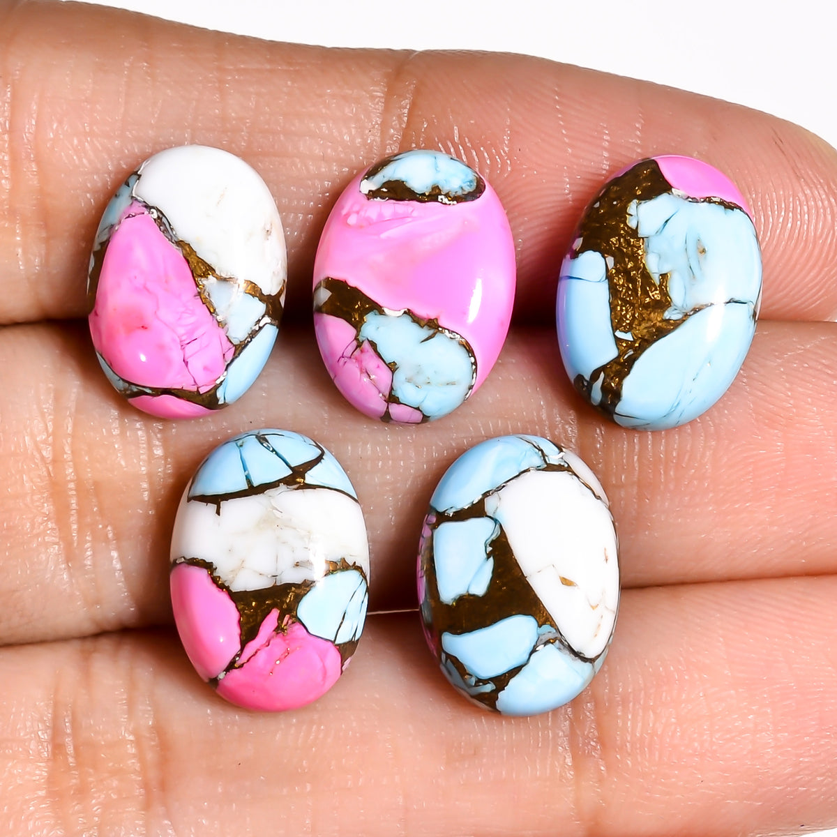 Close up detail of the marbled pink and cream pattern unique to this Mohave Turquoise piece, no two stones forming the exact same blend