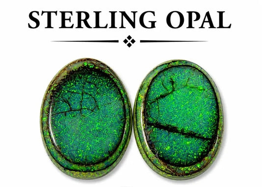 Pair of oval lab-created Monarch opal cabochons in dark green with crackled black matrix and neon green flecks, flat back, on white background