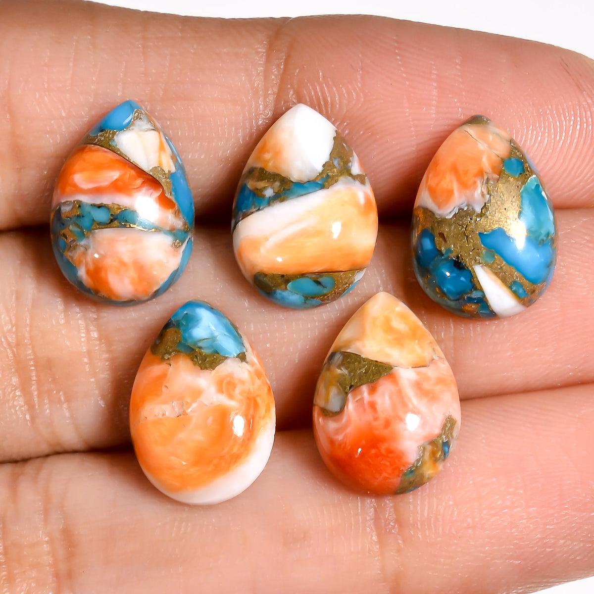 Multi color Turquoise cabochon offered as part of a wholesale lot for jewelry designers seeking visually varied statement stones