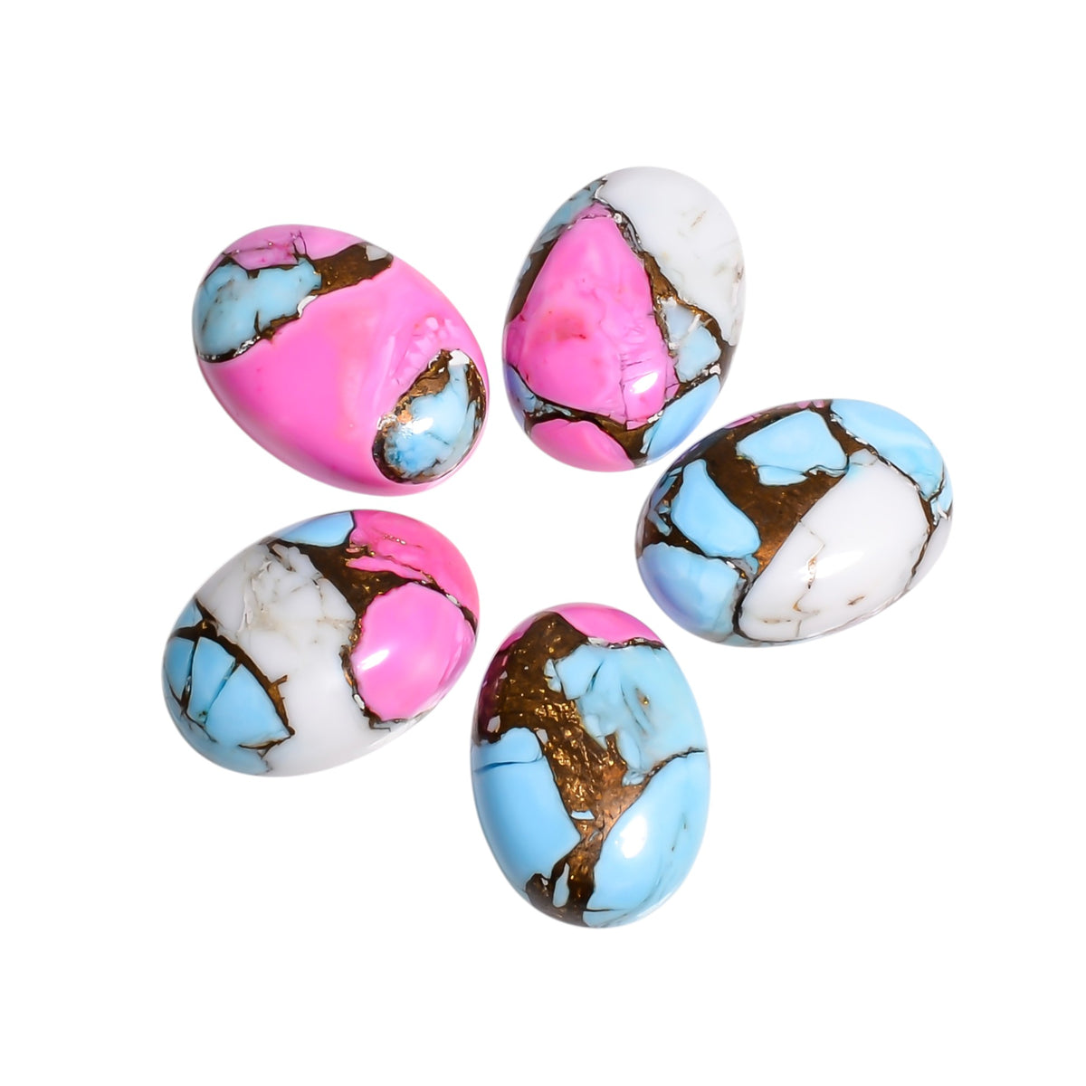 A pair of Pink and White Mohave Turquoise cabochons arranged for bridal jewelry inspiration, showing how the soft palette suits wedding day pieces