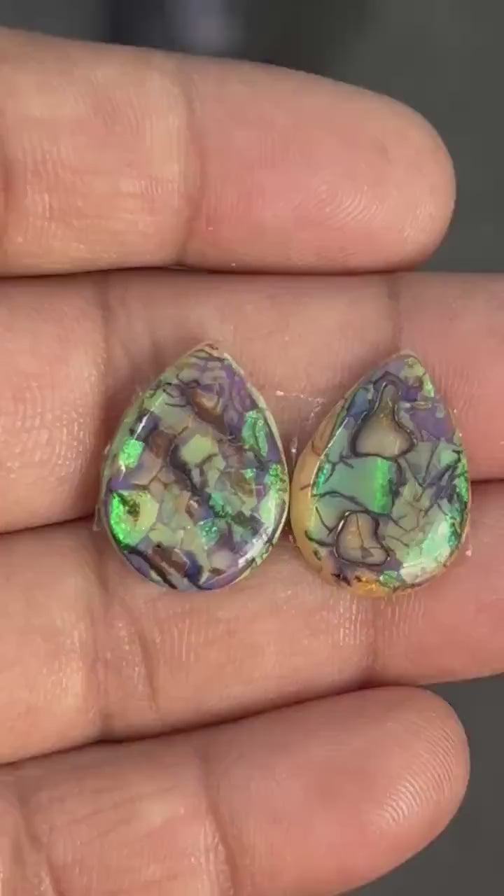 Pear shape matched pair of lab created opal cabochons