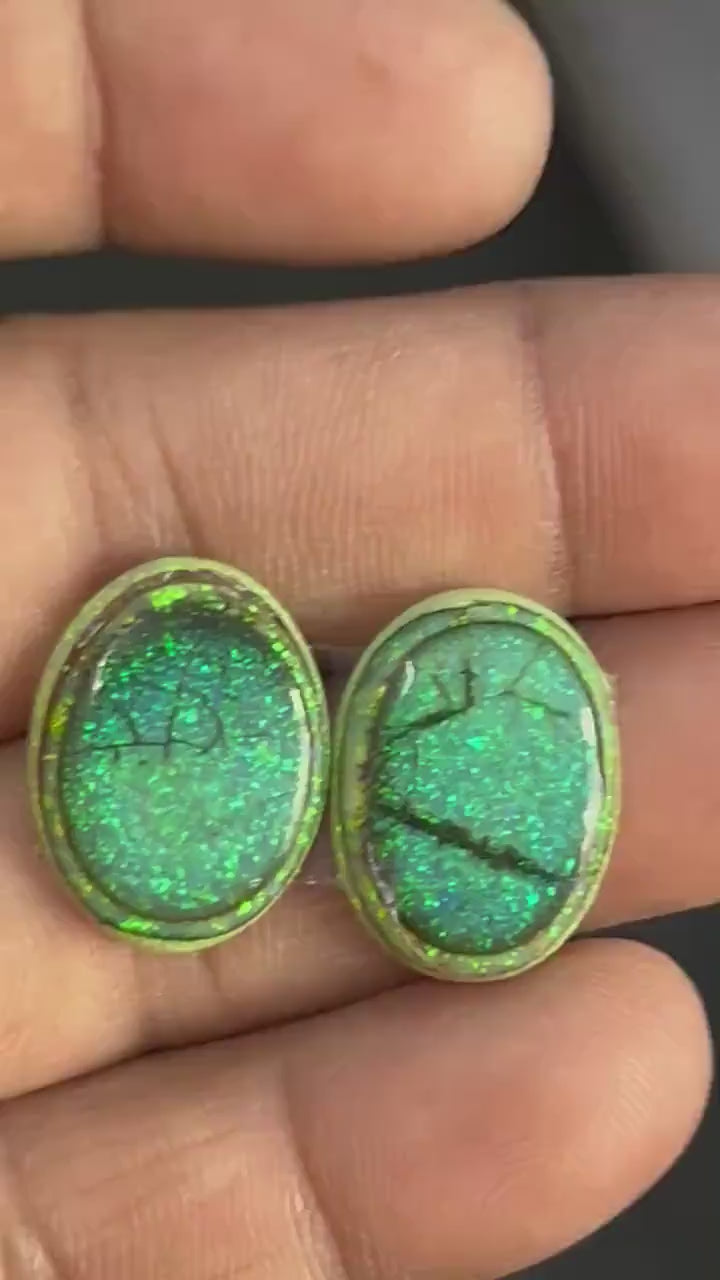 lab created Monarch opal cabochons in dark green with crackled black matrix and neon green flecks, flat back