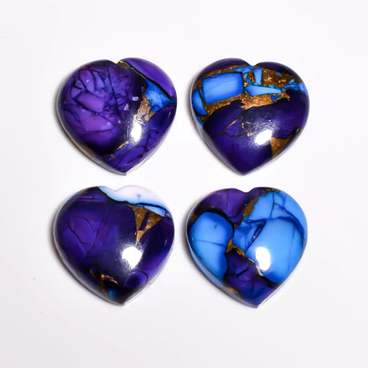 Purple and blue turquoise cabochon hearts showing copper turquoise matrix and glossy domes, top view