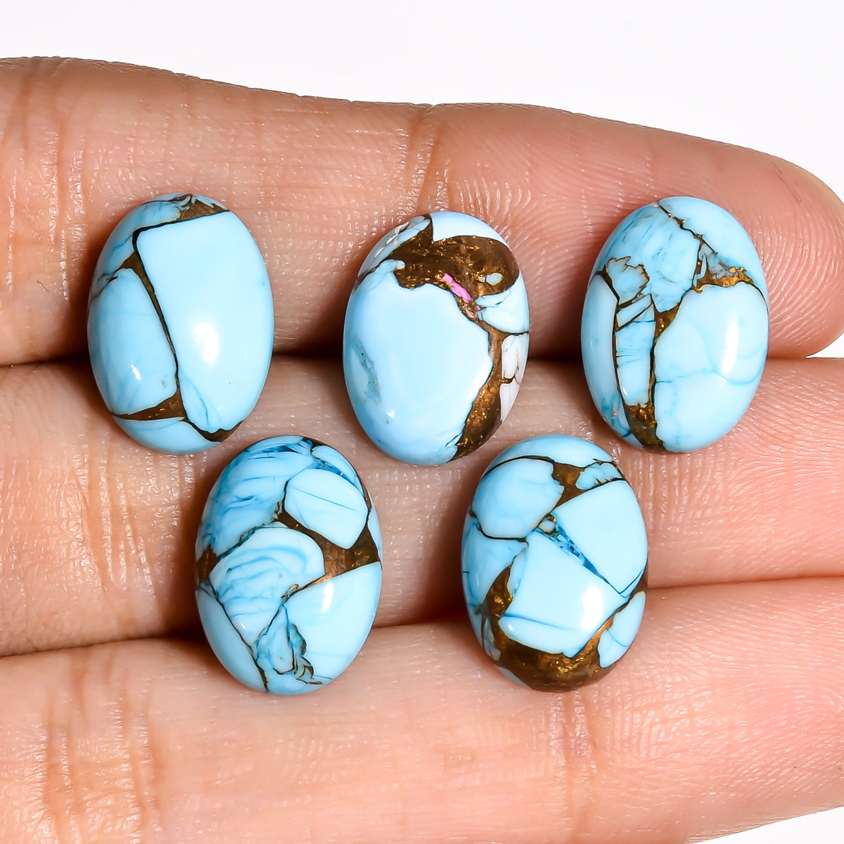 Sky Blue Turquoise pictured as ring inspiration, showing how the light, airy blue tone works well for engagement and promise ring designs
