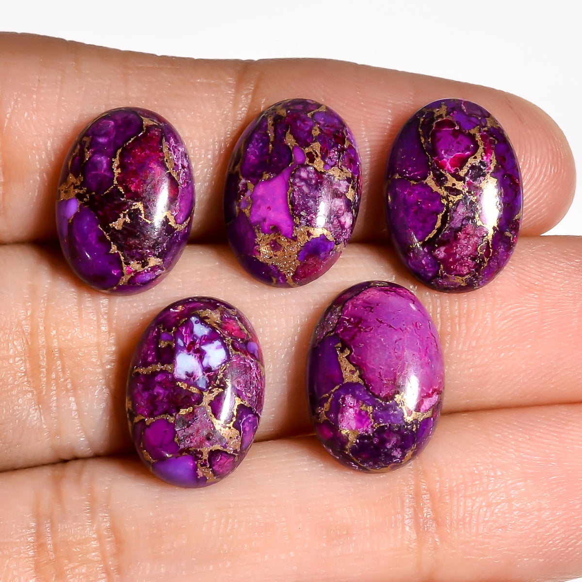 Small Purple Turquoise oval cabochon well matched to drop earring designs, where a compact stone size works best
