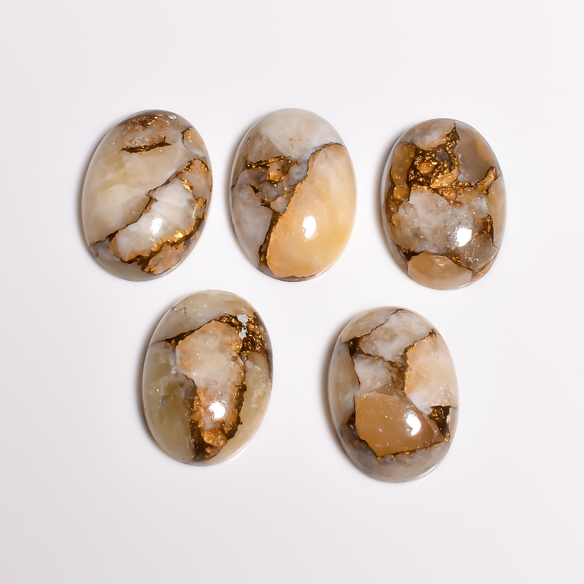 Gold Turquoise pictured within a broader crystal collection display, showing how it complements other earth toned gemstones on a shelf or altar