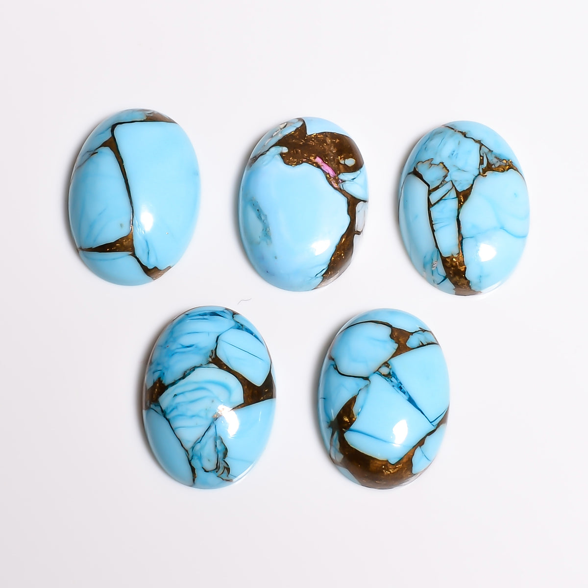 Side profile view of the Sky Blue Turquoise cabochon showing its polished dome height, useful for buyers judging bezel depth needed
