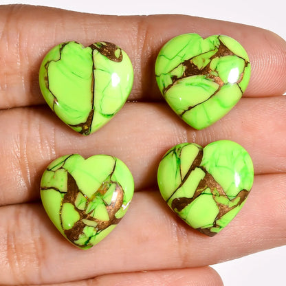 Green turquoise stones for jewelry making, turquoise heart cabochons held on a hand to show 15 MM size