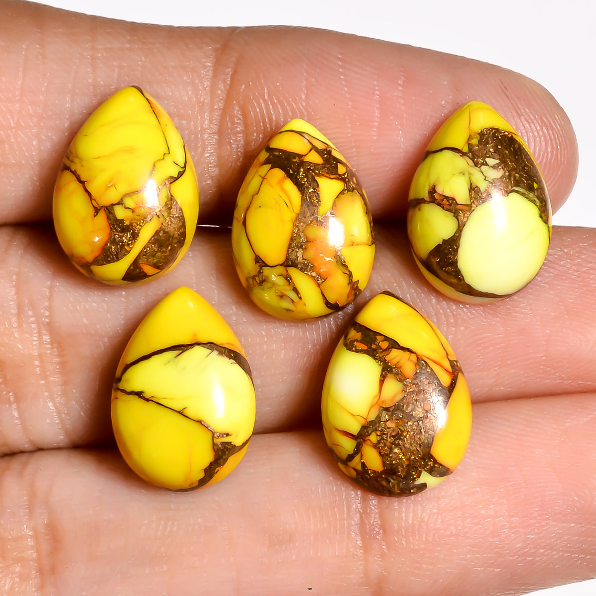 Yellow Turquoise cabochon shaped for ring settings, offering jewelry designers a bold, unconventional color choice for custom pieces